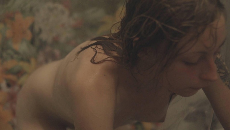 Arielle Holmes in a short skirt breasts